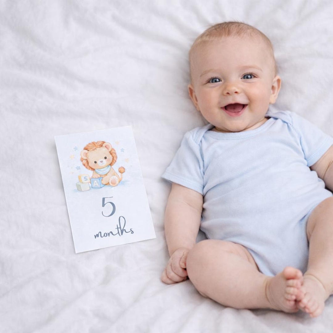 Blue watercolor baby boy milestone cards with planes, cars, and animals