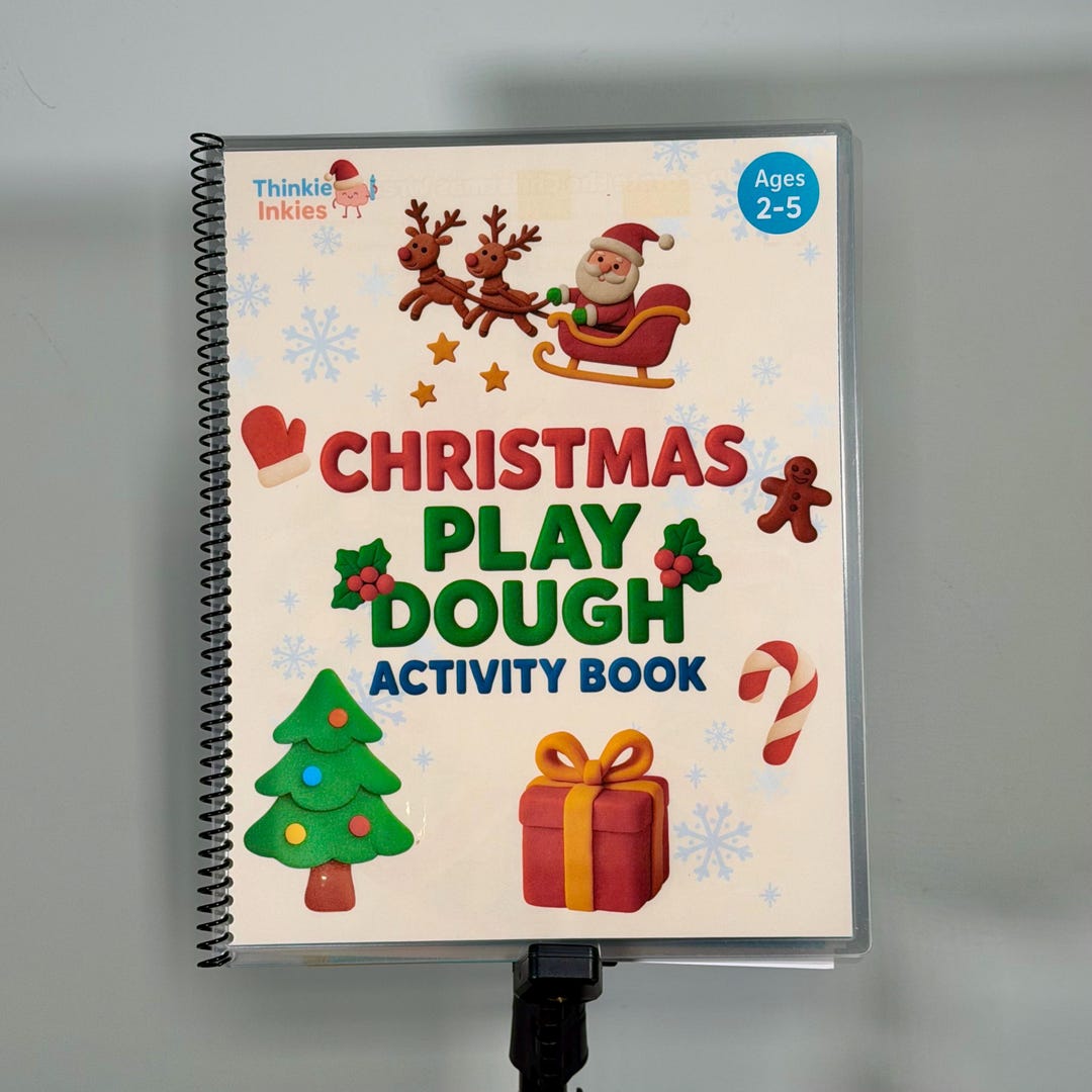Christmas-themed laminated play dough activity book with reusable pages